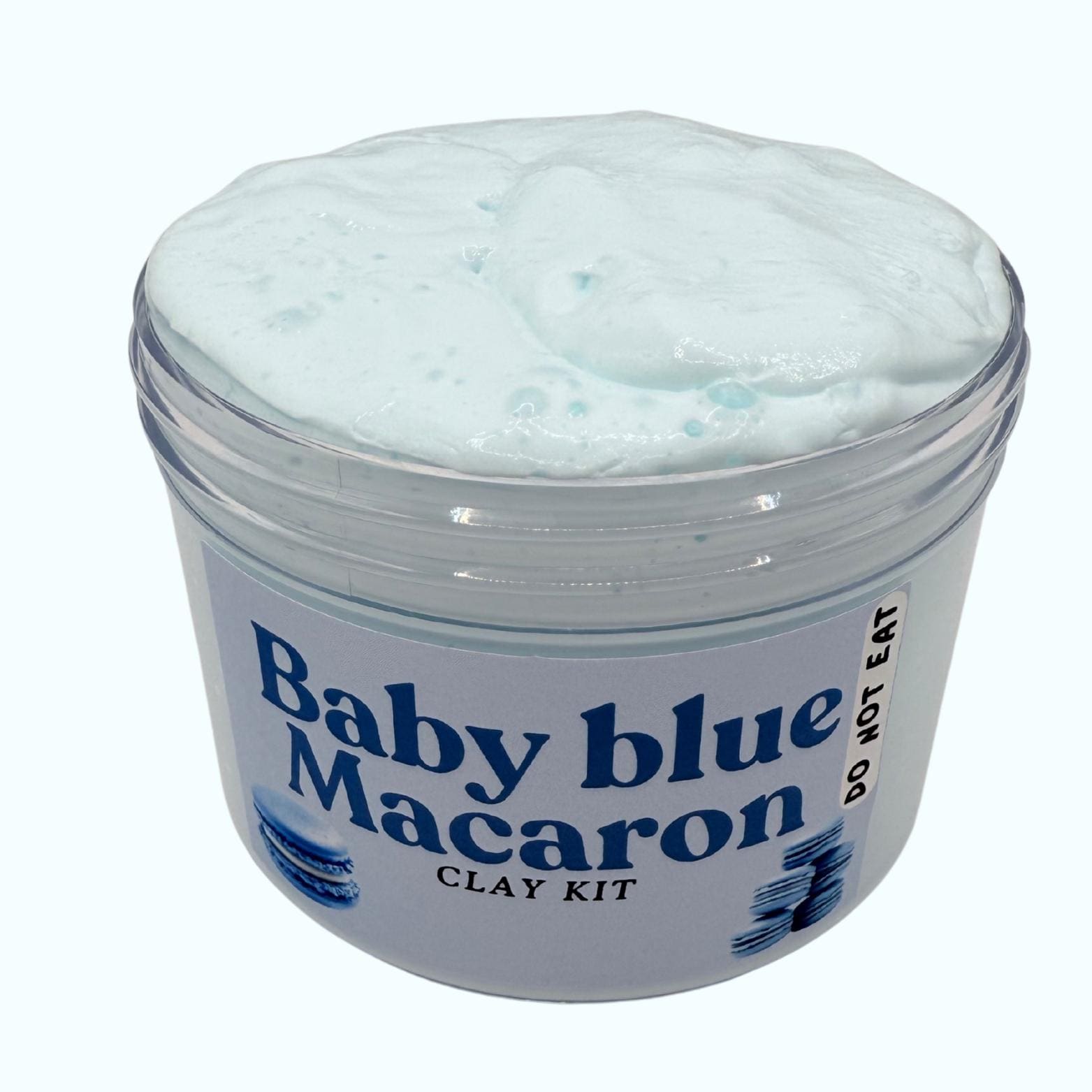 Jar of blue clay with 'Baby Blue Macaron' label on a white background